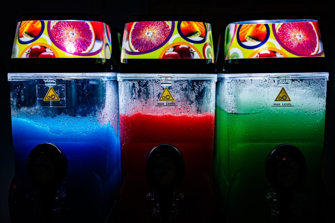 Three signature Bobafat bubble tea drinks floating in a futuristic space cantina setting with neon lighting